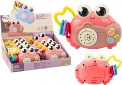 Rosa interaktiver Krebs mit Projektor und Rassel auf Batterien