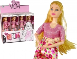 Schwangere Puppe im rosa Kleid mit Blumen