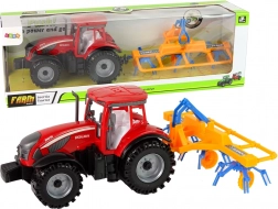 Roter Traktor mit Schwader und Reibungsantrieb