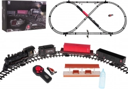 Eisenbahnstrecke mit rauchender Lokomotive, Licht und Musik