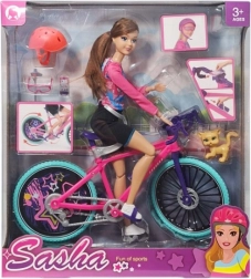 Puppe auf einem Fahrrad mit Zubehör