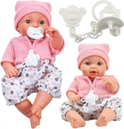 Stoffpuppe mit Mütze und Geräuschen