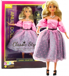 Puppe Anlily in hellrosa Kleid mit Punkten und beweglichen Gliedmaßen