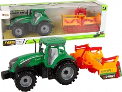 Grüner Traktor mit orangefarbenem Kultivator – Set mit Schwung­antrieb für Kinder