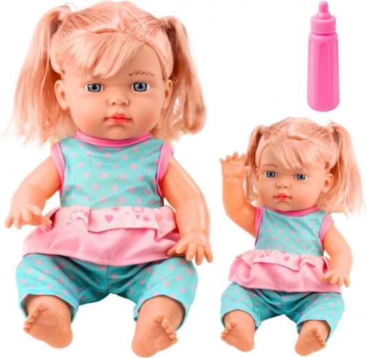 Puppe Baby im türkisfarbenen Set mit Flasche und Geräusch