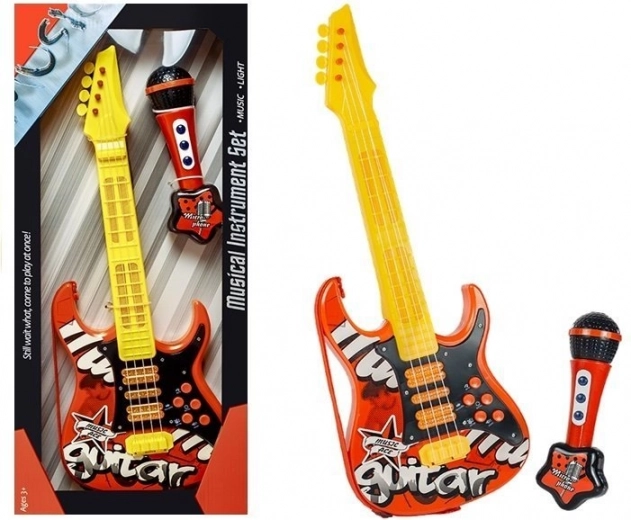 Elektrische Kindergitarre und Mikrofon rot