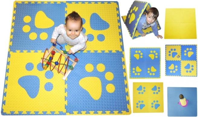 Schaumstoff-Kinderteppich mit blauen und gelben Pfotenabdrücken