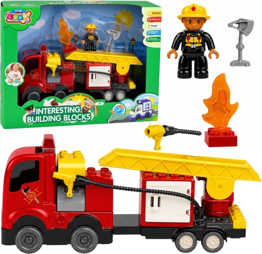 Baukasten Feuerwehrfahrzeug mit Friktionsantrieb, Leiter und Feuerwehrmann-Figur