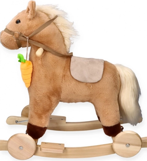 Schaukelpferd mit Möhre