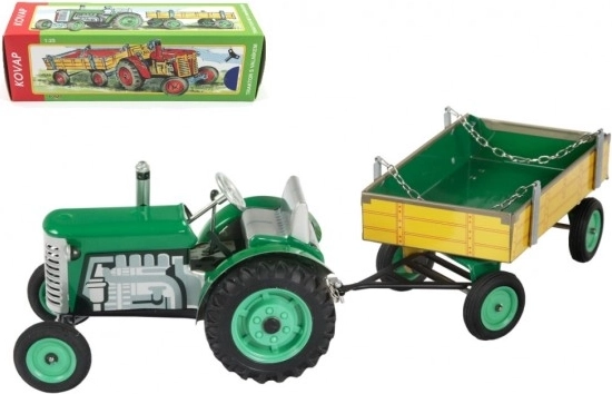 Grüner Zetor Traktor mit Anhänger und Federwerk Kovap
