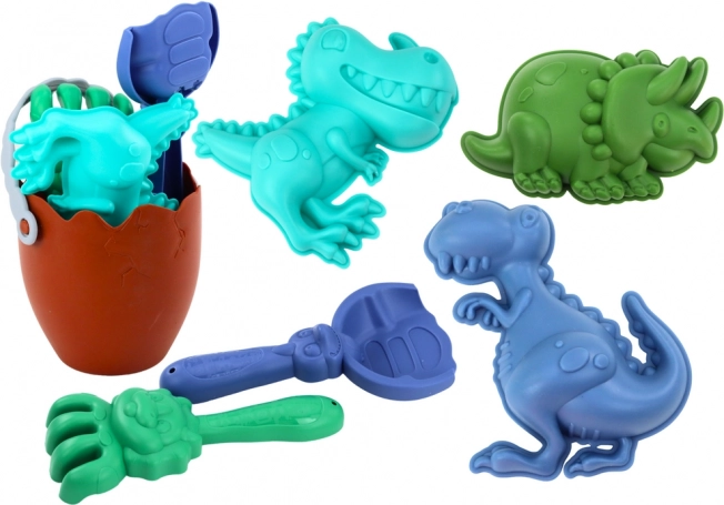 Sandspielset Dinosaurier mit eiförmigem Eimer, Schaufel, Harke und Förmchen