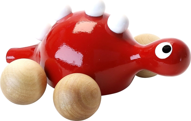 Roter Holzdinosaurier auf Rädern