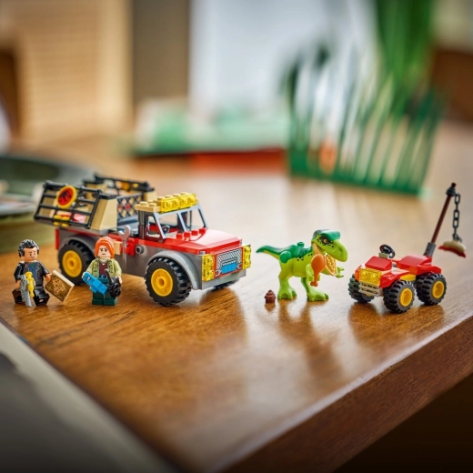 Fangen Sie das Baby T. rex und transportieren Sie es sicher