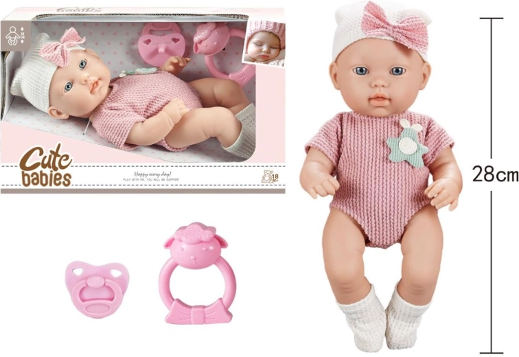 Baby mit Schnuller und Rassel