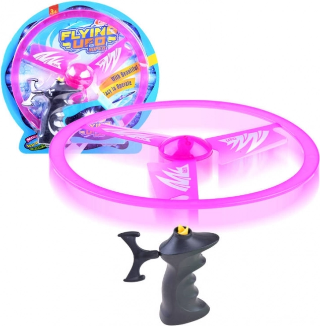 Fliegende Scheibe mit Abschussvorrichtung und Lichteffekt – Rosa