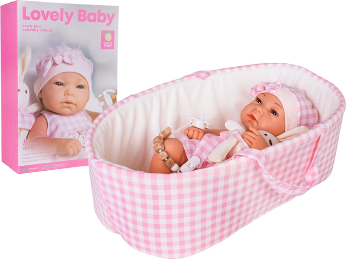 Babypuppe im rosa Tragesitz