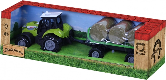 Traktor mit Sound und Licht mit Anhänger und Strohballen