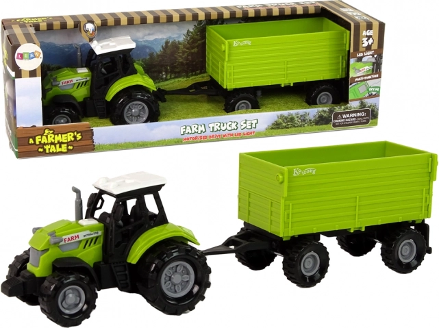 Grüner landwirtschaftlicher Traktor mit Anhänger