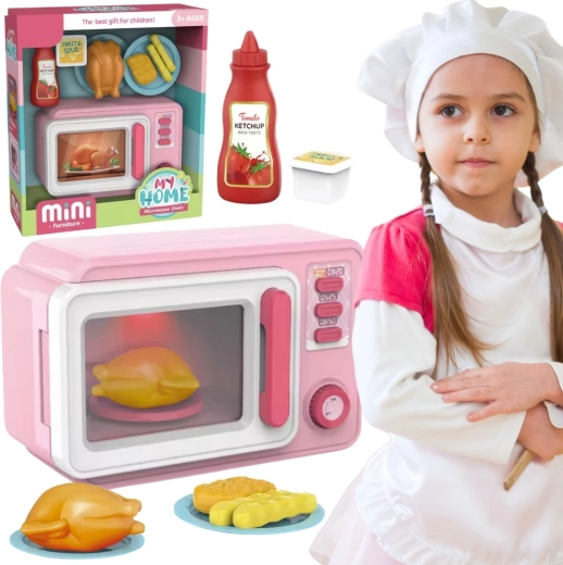 Rosa Kinder-Mikrowelle mit Zubehör