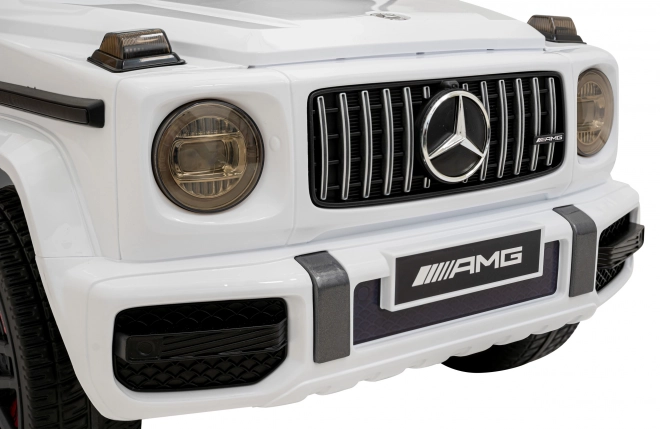 Mercedes AMG G63 für Kinder weiß + Fernbedienung + MP3 LED + langsamer Start + EVA + Gurte