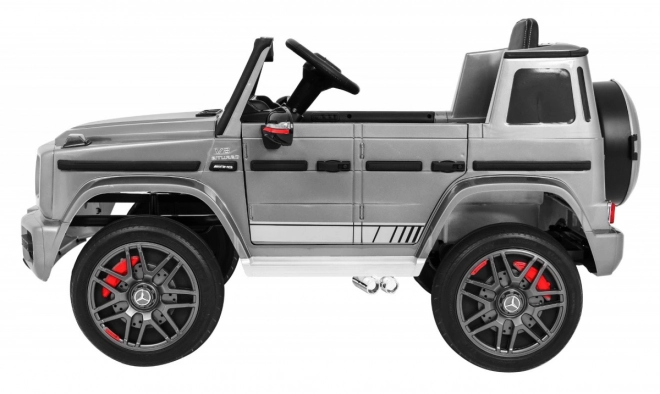 Mercedes AMG G63 für Kinder Silberlack + Fernbedienung + MP3 LED + langsamer Start + EVA + Gurte