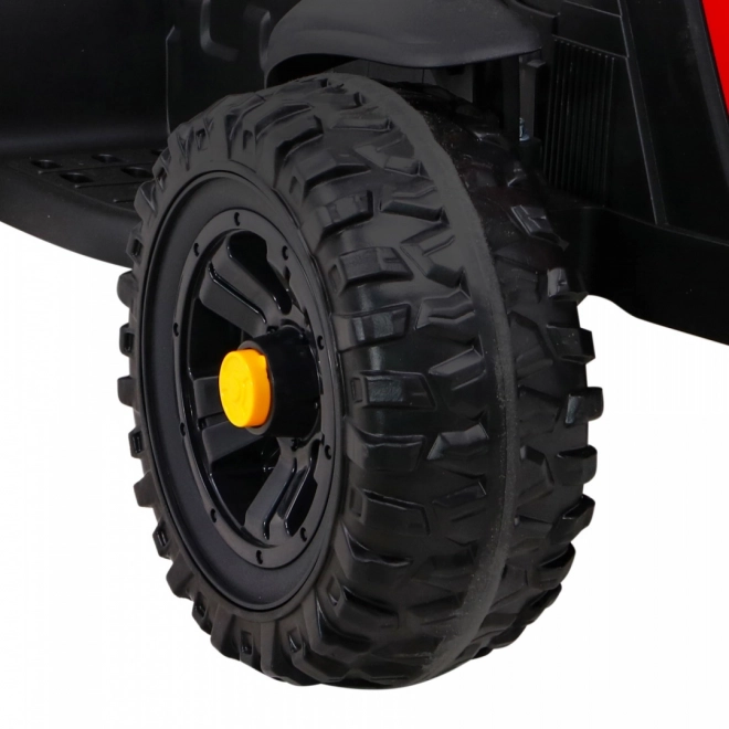 Titan-Traktor mit rotem Anhänger