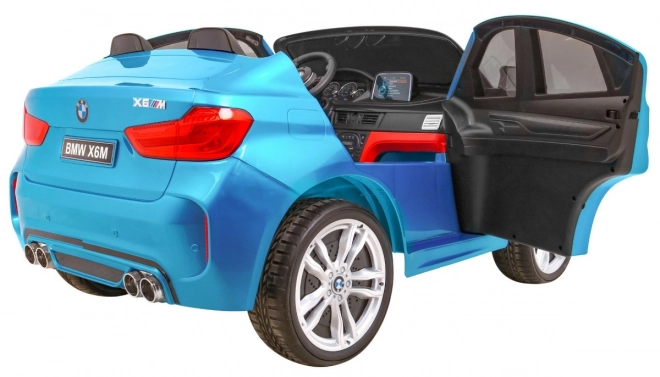 BMW X6M XXL pro 2 Kinder Blaue Farbe + Pilot + Eco-Leder + Sicherheitsgurte + Langsamer Start + MP3 + LED