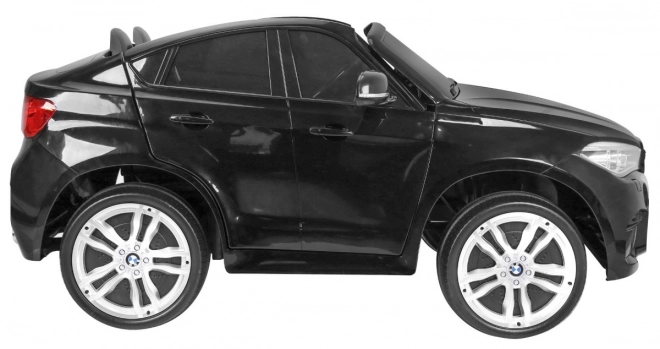BMW X6M XXL pro 2 Kinder schwarz + Fernbedienung + Öko-Leder + Sicherheitsgurte + Langsame Anfahrt + MP3 USB + LED-Diode