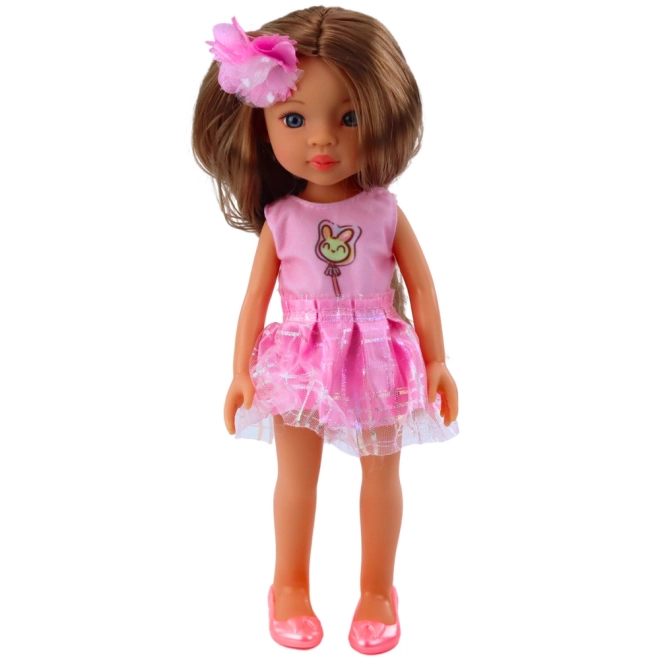 Puppe mit rosa Kleid und braunen Haaren