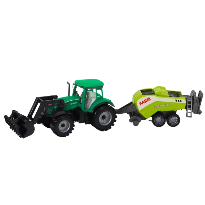 Grüner Traktor mit Lader und kompatibler Ballenpresse