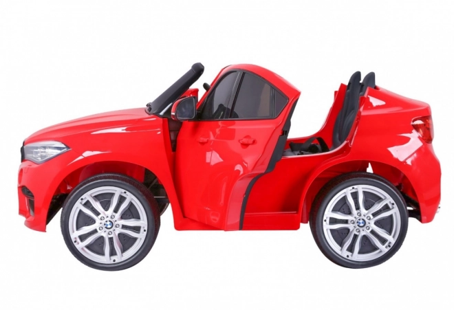 BMW X6M XXL pro 2 Kinder Rot + Fernbedienung + Ökoleder + Sicherheitsgurte + Langsamer Start + MP3 USB + LED-Leuchte