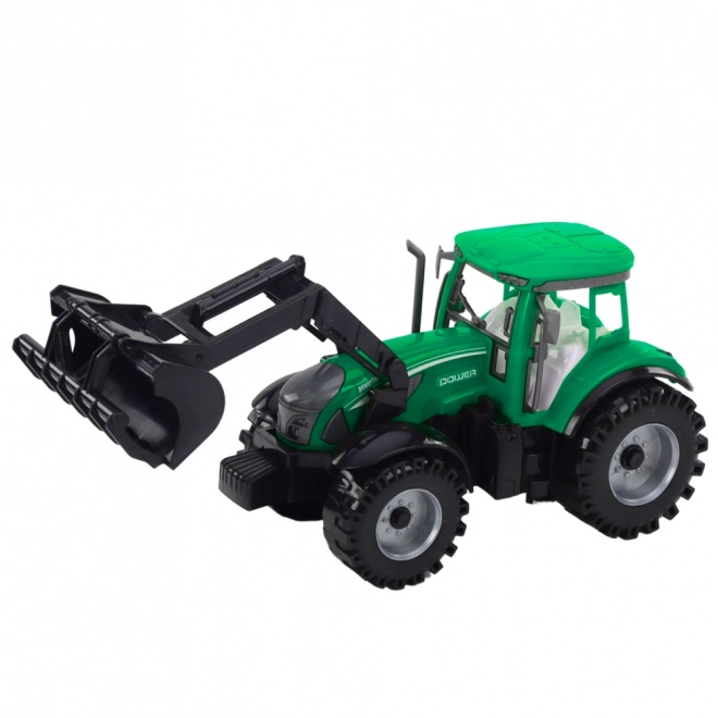 Grüner Traktor mit Lader und kompatibler Ballenpresse