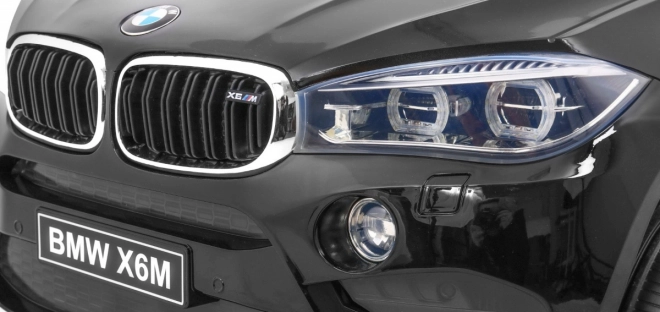 BMW X6M Elektrisches Kinderauto Schwarz + Fernbedienung + EVA + Langsamer Start + Audiopanel + LED-Diode