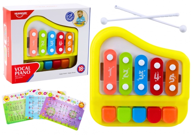 Gelbes Kinderxylophon und Mini-Klavier