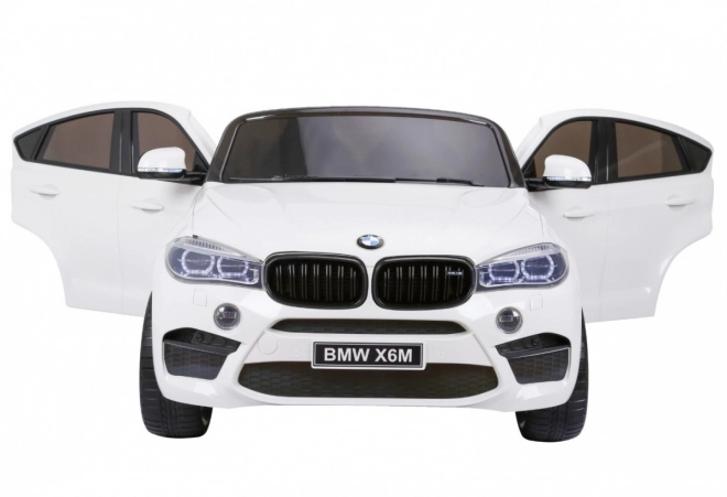 BMW X6M XXL pro 2 Kinder Weiß + Fernsteuerung + Eco-Leder + Sicherheitsgurte + langsamer Start + MP3 USB + LED