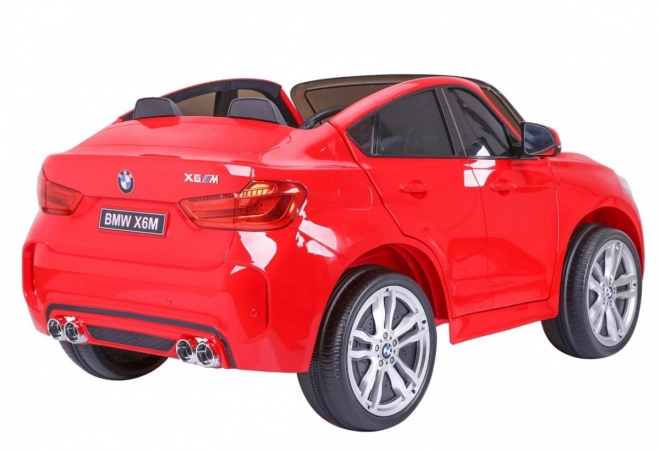BMW X6M XXL pro 2 Kinder Rot + Fernbedienung + Ökoleder + Sicherheitsgurte + Langsamer Start + MP3 USB + LED-Leuchte
