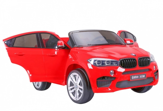 BMW X6M XXL pro 2 Kinder Rot + Fernbedienung + Ökoleder + Sicherheitsgurte + Langsamer Start + MP3 USB + LED-Leuchte