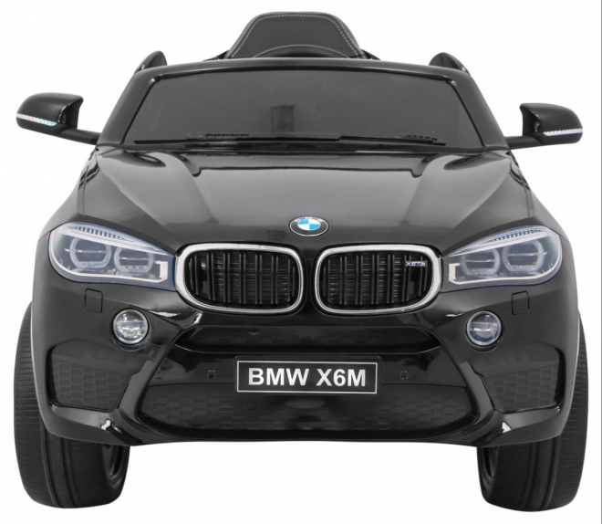 BMW X6M Elektrisches Kinderauto Schwarz + Fernbedienung + EVA + Langsamer Start + Audiopanel + LED-Diode