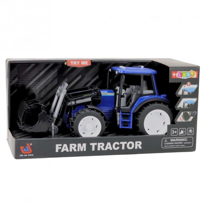 Kindlicher Traktor mit beweglicher Schaufel blau