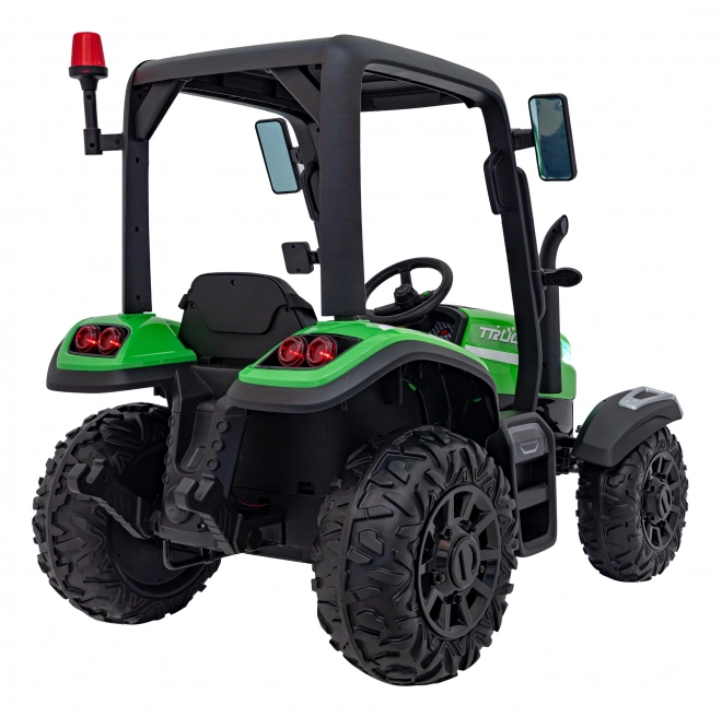 Kindertraktor mit grünem Anhänger