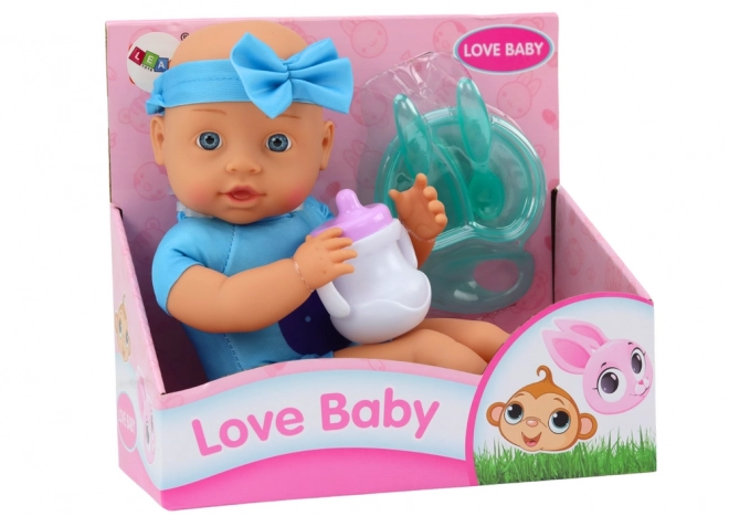 Puppe Baby mit Stirnband und Fütterungszubehör Blau