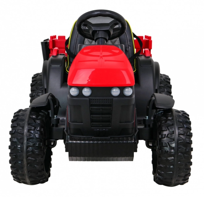 Titan-Traktor mit rotem Anhänger