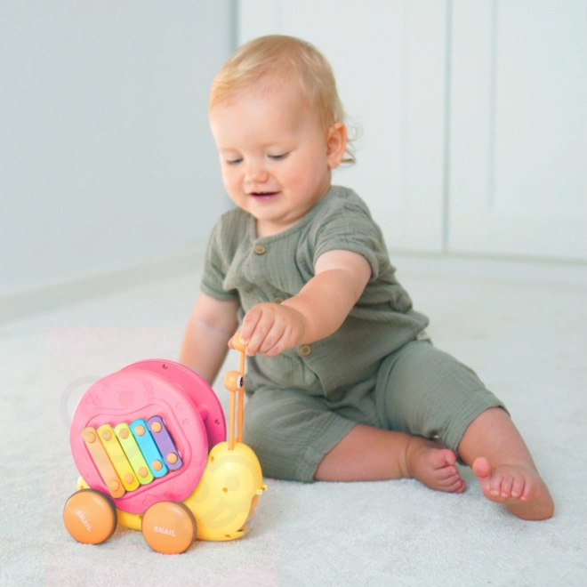 Multifunktionales WOOPIE Spielzeug Schnecke mit Xylophon und Autoabschuss