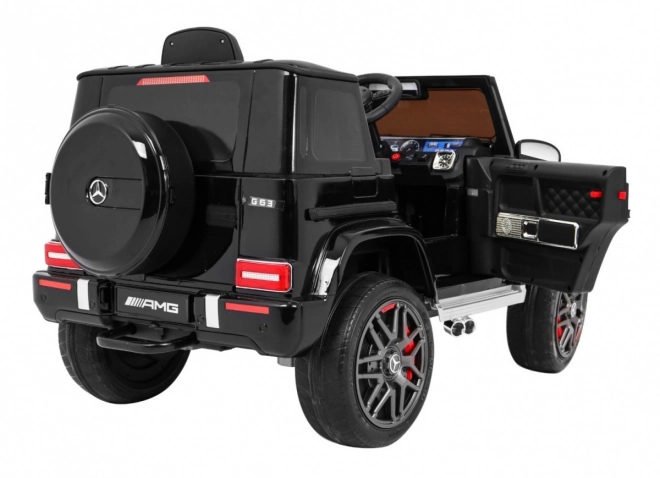 Mercedes AMG G63 für Kinder Lack schwarz + Fernbedienung + MP3 LED + langsamer Start + EVA + Gurte