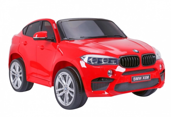 BMW X6M XXL pro 2 Kinder Rot + Fernbedienung + Ökoleder + Sicherheitsgurte + Langsamer Start + MP3 USB + LED-Leuchte