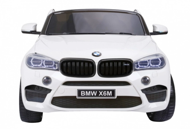 BMW X6M XXL pro 2 Kinder Weiß + Fernsteuerung + Eco-Leder + Sicherheitsgurte + langsamer Start + MP3 USB + LED