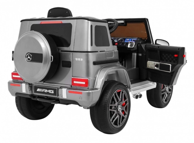 Mercedes AMG G63 für Kinder Silberlack + Fernbedienung + MP3 LED + langsamer Start + EVA + Gurte