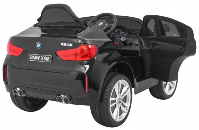 BMW X6M Elektrisches Kinderauto Schwarz + Fernbedienung + EVA + Langsamer Start + Audiopanel + LED-Diode