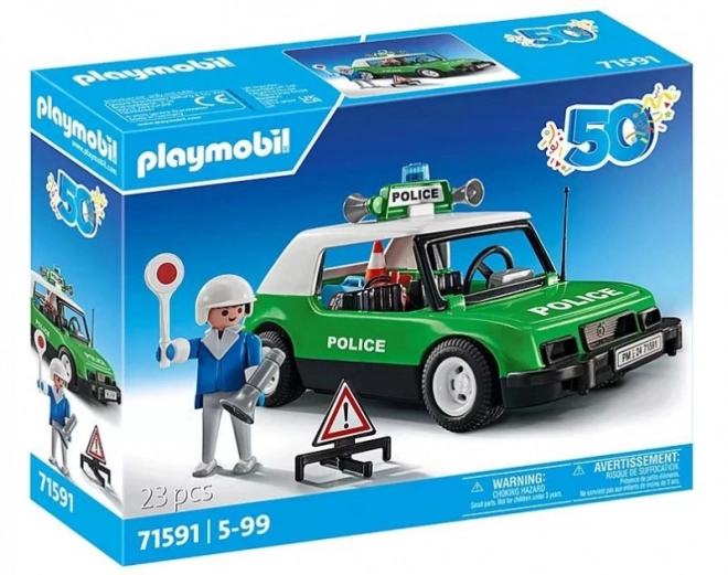 Klassischer Polizeiwagen mit Figur