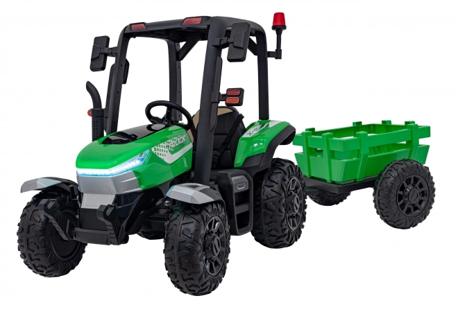 Kindertraktor mit grünem Anhänger